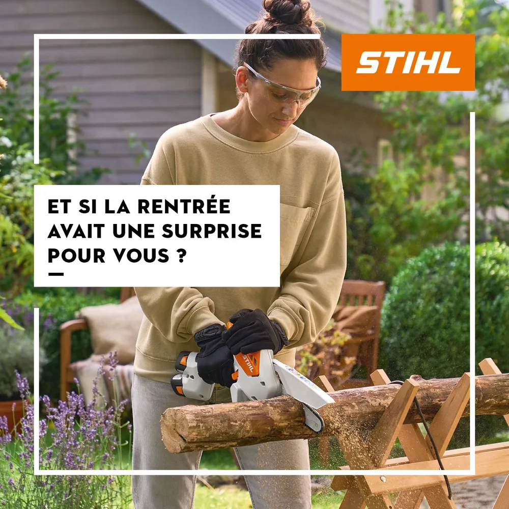Une élagueuse Stihl à batterie en train de couper une bûche